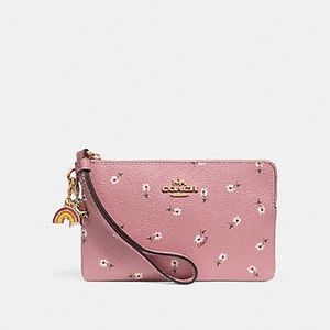 Coach 100% authentic wristlet with charms